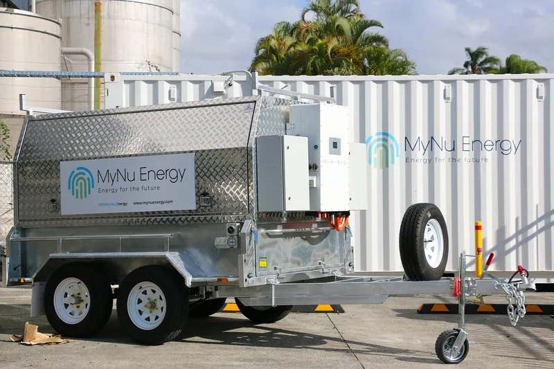 Silver utility trailer with spare tire