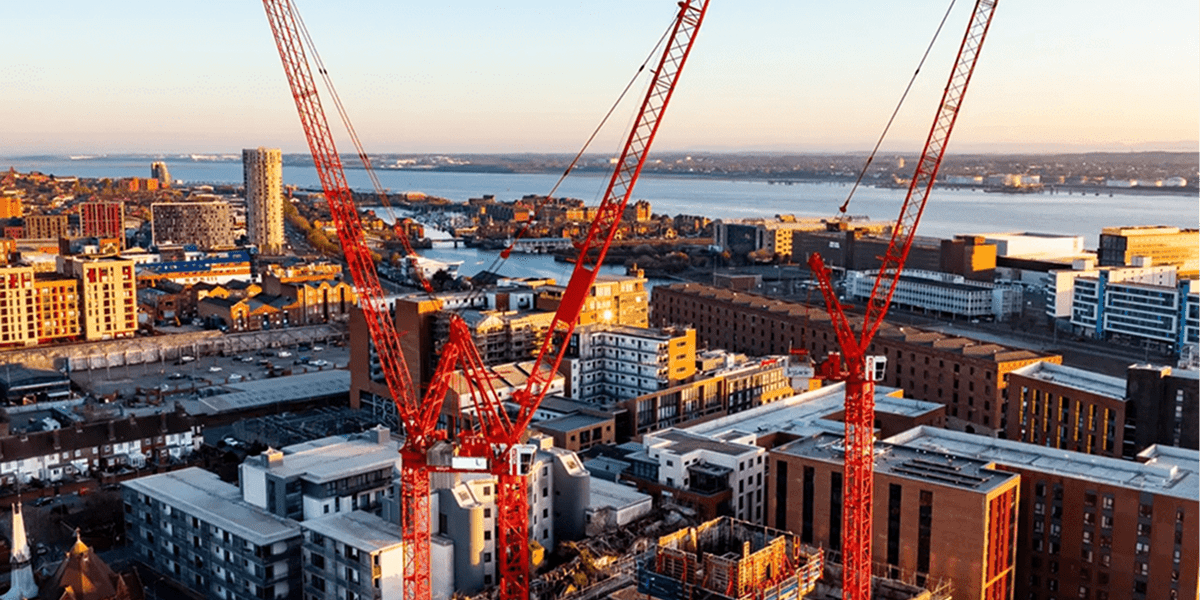 Urban skyline with building cranes
