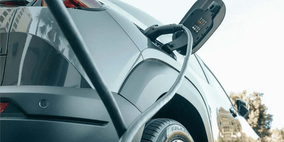 Close-up of electric vehicle being charged